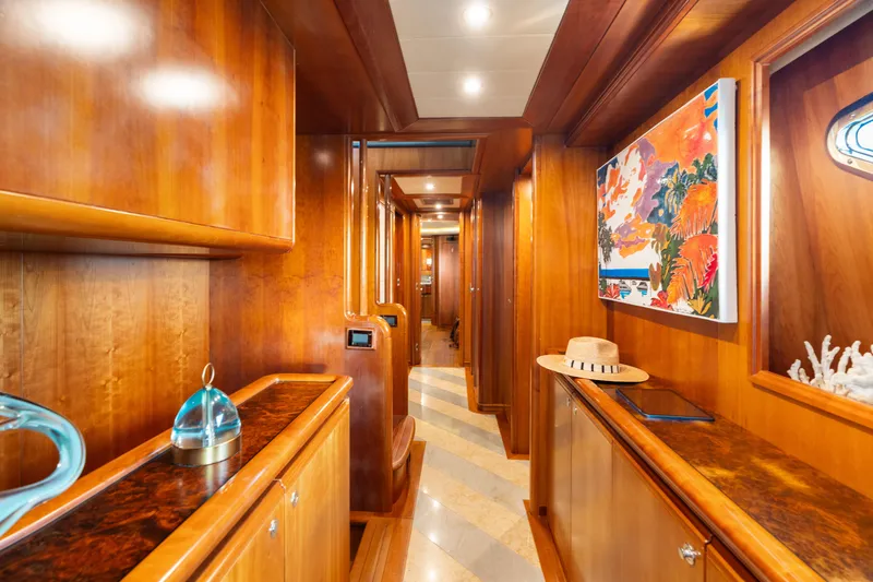 Mambo Yacht Photos Pics Luxurious wooden interior of 2004 Ferretti Yachts 112 Custom Line with vibrant artwork.