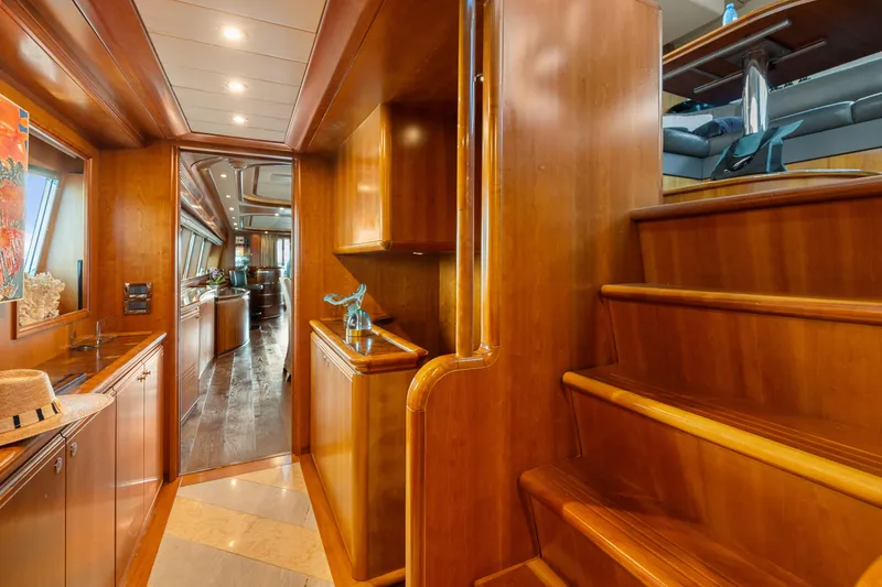 Mambo Yacht Photos Pics Luxurious interior of 2004 Ferretti Yachts 112 Custom Line with elegant wood finishes.