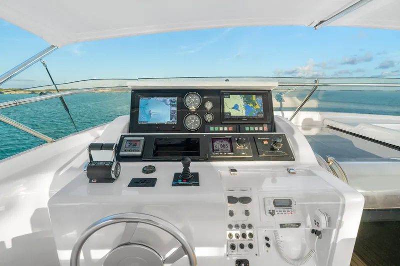 Mambo Yacht Photos Pics Helm of 2004 Ferretti Yachts 112 Custom Line with navigation equipment and ocean view.