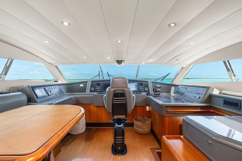 Mambo Yacht Photos Pics Luxurious helm of 2004 Ferretti Yachts 112 Custom Line, featuring modern navigation controls.