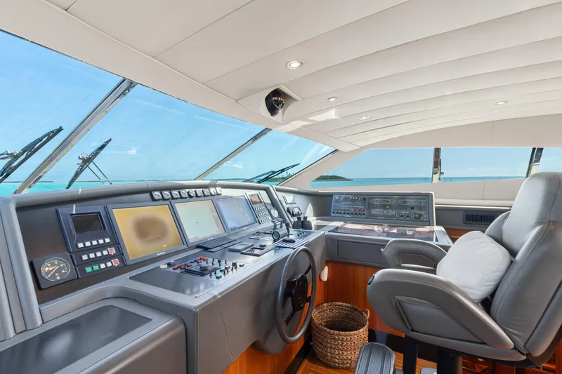 Mambo Yacht Photos Pics Helm of 2004 Ferretti Yachts 112 Custom Line with modern navigation equipment and ocean view.