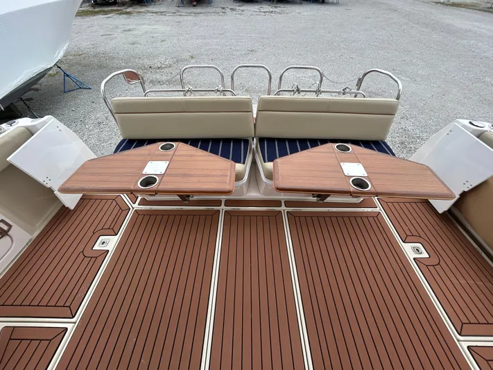  Yacht Photos Pics 2023 Ranger Tugs R-43 CB boat deck with wooden flooring and foldable tables.