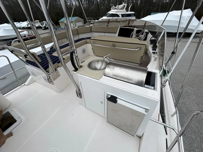  Yacht Photos Pics 2023 Ranger Tugs R-43 CB boat deck with sink and seating area.