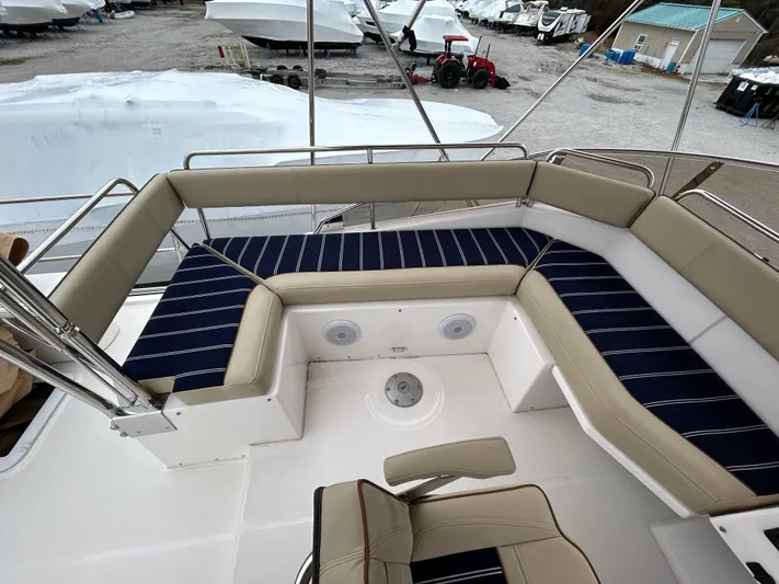  Yacht Photos Pics 2023 Ranger Tugs R-43 CB boat deck with cushioned seating and striped upholstery.