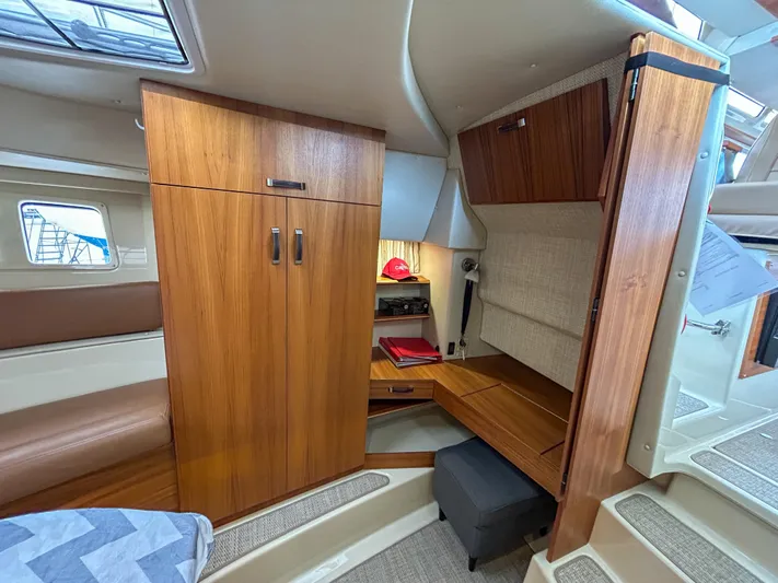  Yacht Photos Pics Interior of 2023 Ranger Tugs R-43 CB, featuring wood cabinetry and seating area.