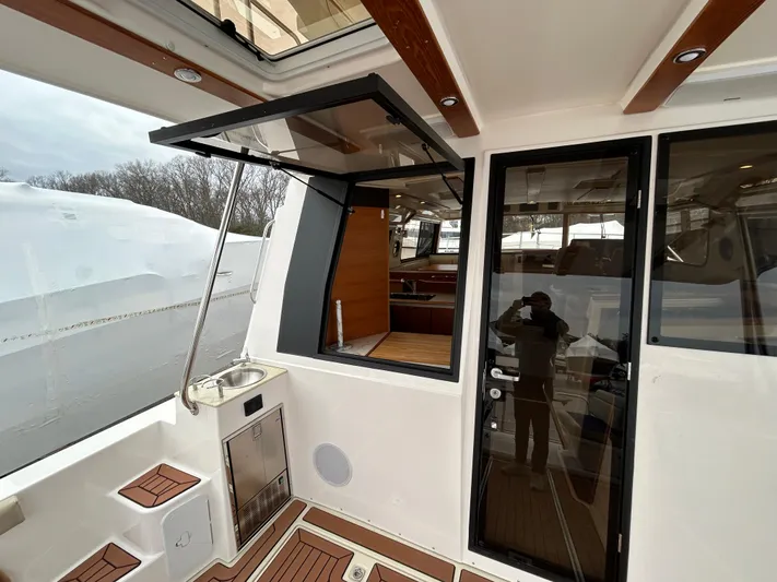  Yacht Photos Pics 2023 Ranger Tugs R-43 CB yacht interior with open window and sleek design.