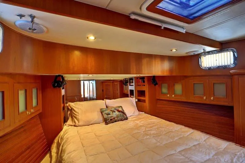 Sharki's Wake Yacht Photos Pics Luxurious cabin interior of 2016 North Pacific 45 Pilothouse yacht with cozy bedding.
