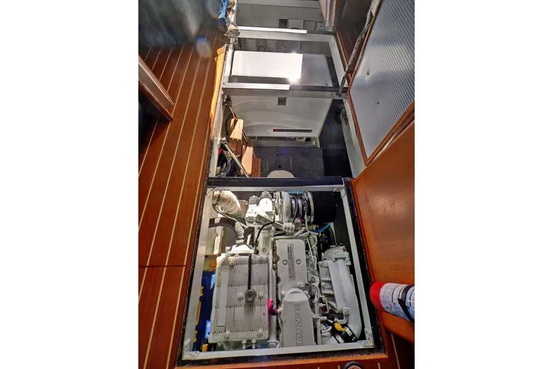 Sharki's Wake Yacht Photos Pics Engine room of 2016 North Pacific 45 Pilothouse yacht, showcasing machinery and equipment.