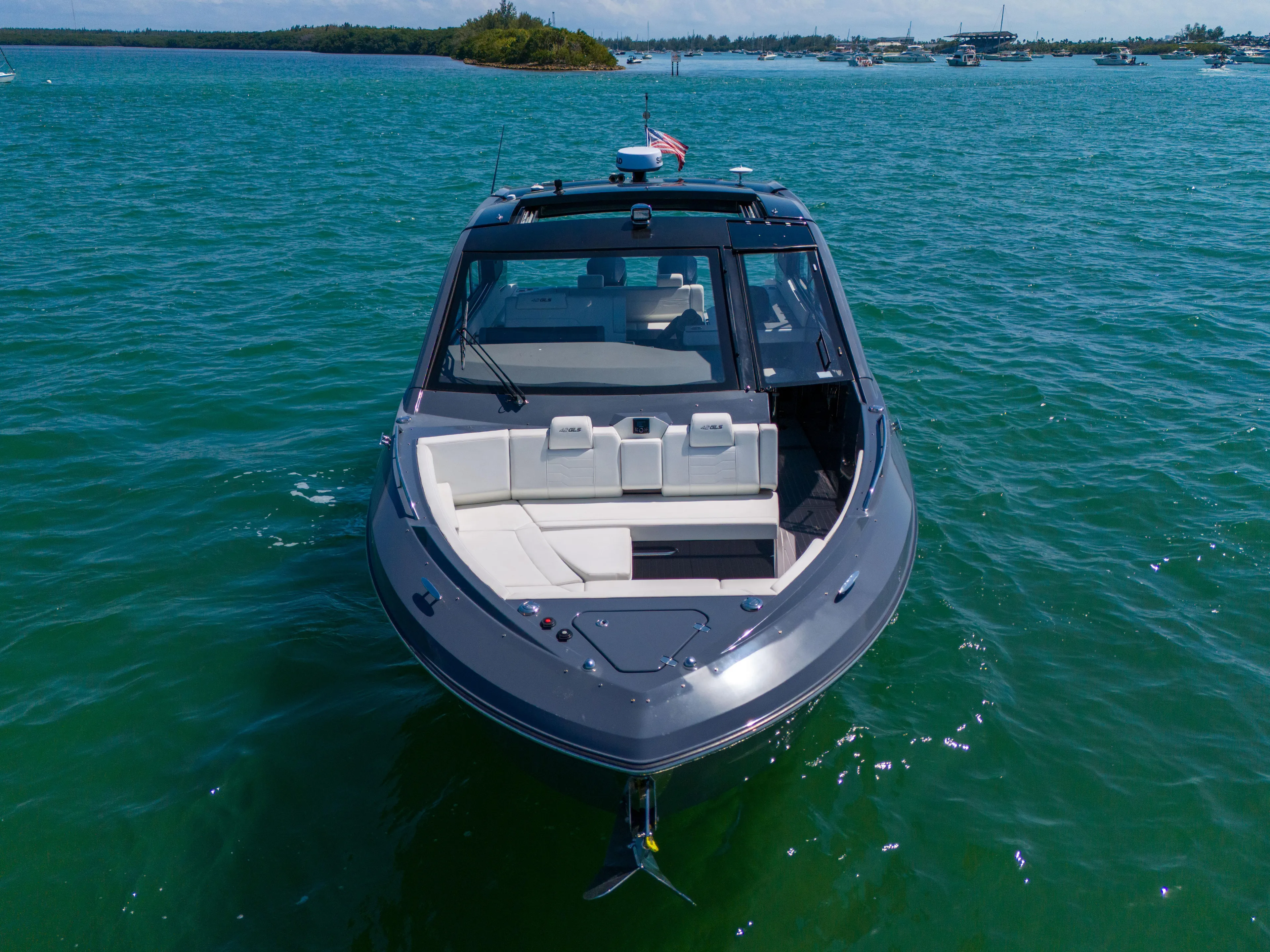  Yacht Photos Pics 2023 Cruisers Yachts 42 GLS OB on clear blue water, front view.