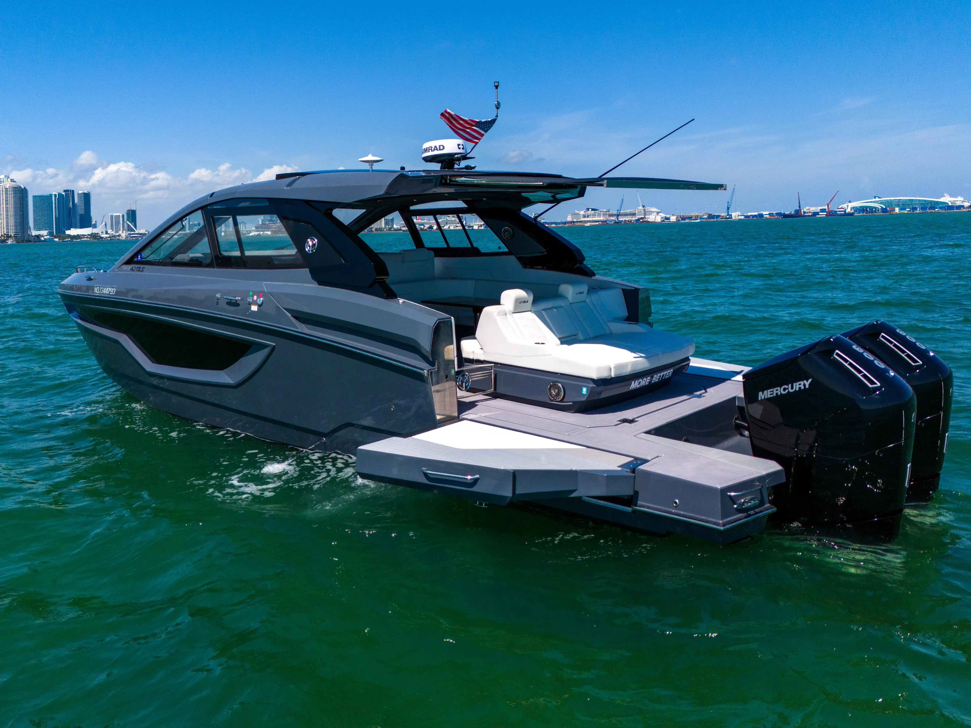  Yacht Photos Pics 2023 Cruisers Yachts 42 GLS OB on water, featuring sleek design and powerful Mercury outboards.