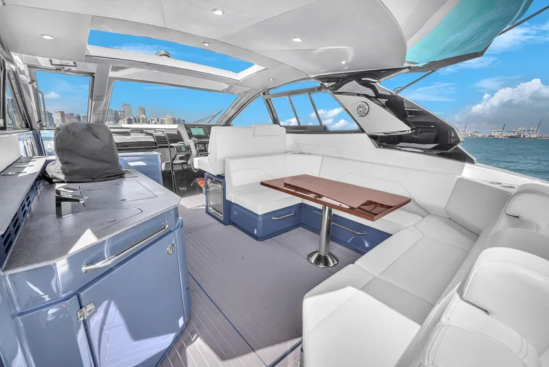  Yacht Photos Pics Luxurious interior of 2023 Cruisers Yachts 42 GLS OB with modern seating and ocean view.