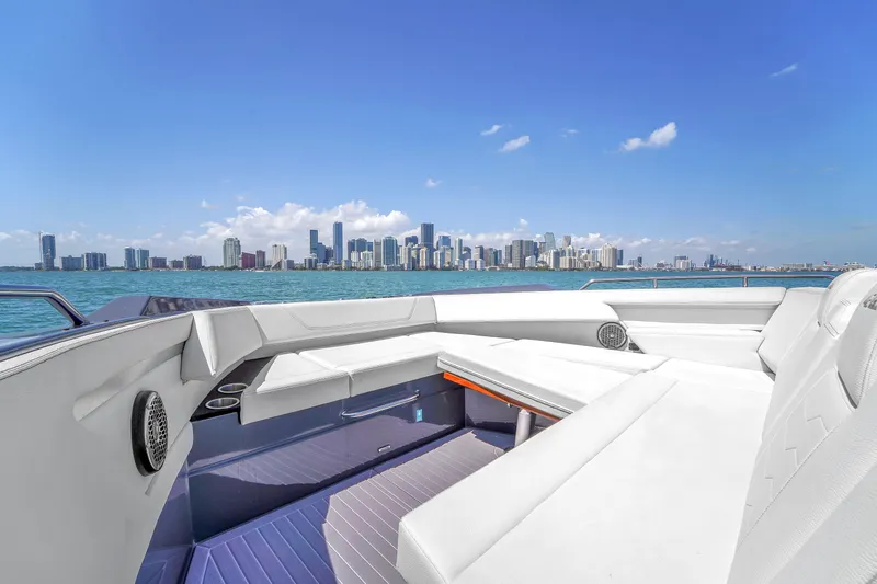  Yacht Photos Pics 2023 Cruisers Yachts 42 GLS OB with city skyline view, luxurious seating, and modern design.