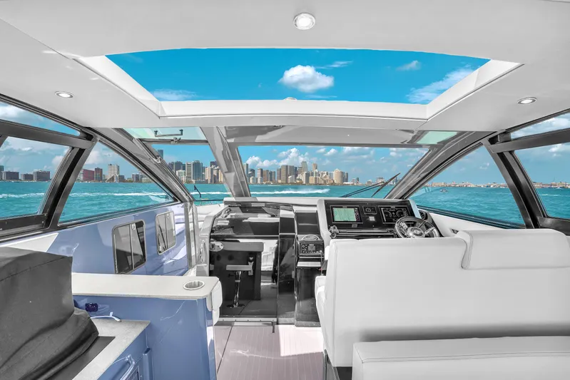  Yacht Photos Pics Interior view of 2023 Cruisers Yachts 42 GLS OB, featuring modern design and city skyline.