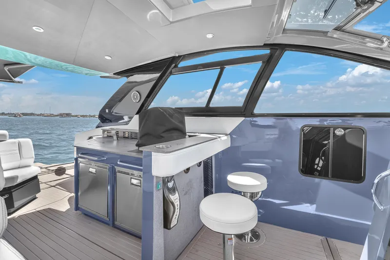  Yacht Photos Pics 2023 Cruisers Yachts 42 GLS OB interior with modern seating and ocean view.