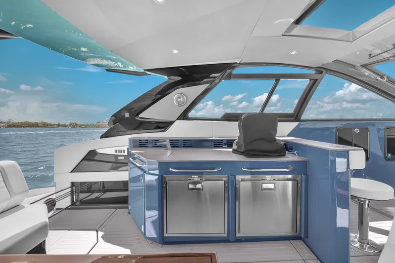  Yacht Photos Pics 2023 Cruisers Yachts 42 GLS OB interior with modern kitchen and ocean view.