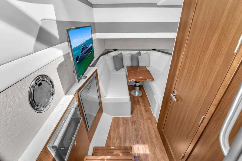  Yacht Photos Pics Luxurious interior of 2023 Cruisers Yachts 42 GLS OB with modern seating and entertainment area.