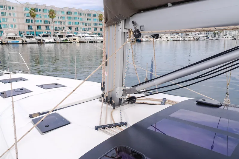 Sacha Marie Yacht Photos Pics 2024 Dufour 470 sailboat deck with marina view, featuring rigging and modern design.