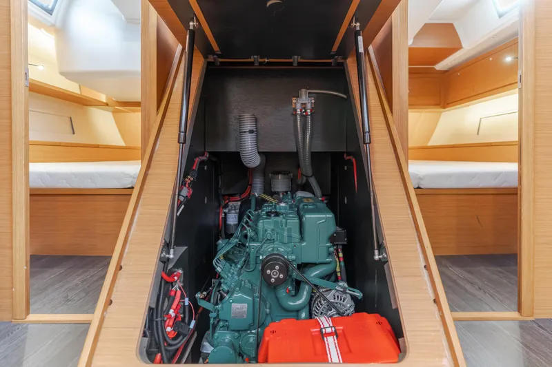 Sacha Marie Yacht Photos Pics 2024 Dufour 470 yacht engine compartment with visible engine and cabin interior.