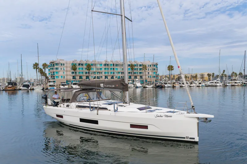 Sacha Marie Yacht Photos Pics 2024 Dufour 470 sailboat docked in marina, modern design, calm waters, coastal backdrop.