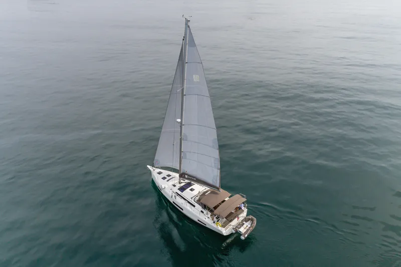 Sacha Marie Yacht Photos Pics 2024 Dufour 470 sailboat cruising on calm ocean waters.