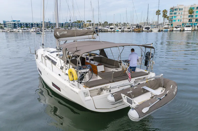 Sacha Marie Yacht Photos Pics 2024 Dufour 470 yacht docked in marina, featuring spacious deck and modern design.