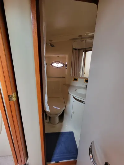  Yacht Photos Pics Bathroom interior of 2000 Sea Ray 460 Sundancer yacht, featuring toilet and sink.