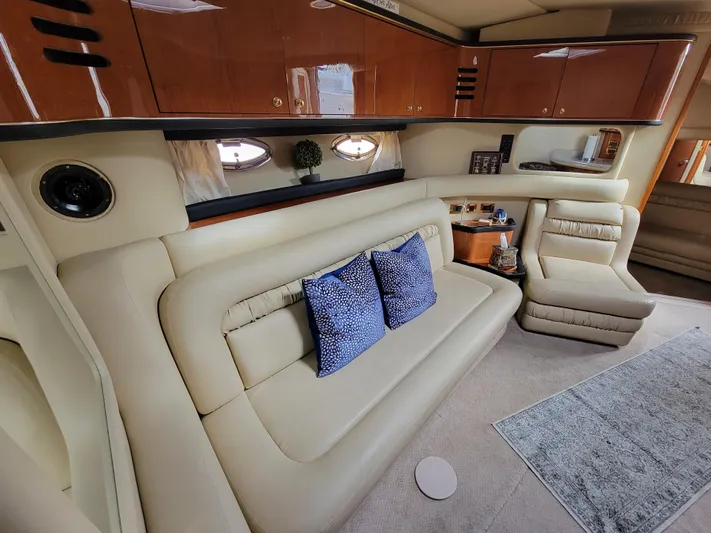  Yacht Photos Pics Luxurious interior of 2000 Sea Ray 460 Sundancer yacht with beige leather seating.