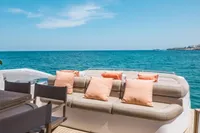 Luxurious 2009 Pershing 72' yacht deck with plush seating and ocean view.