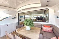 Luxurious 2009 Pershing 72' yacht interior with elegant seating and dining area.