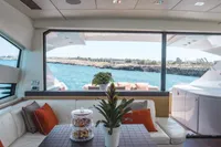Luxurious interior of a 2009 Pershing 72' yacht with ocean view and elegant decor.