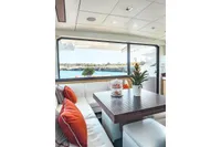 Luxurious interior of 2009 Pershing 72' yacht with ocean view and elegant decor.