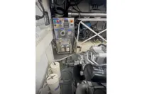 Engine room of a 2009 Pershing 72' yacht with control panel and machinery.