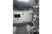 Engine room of 2009 Pershing 72' yacht featuring a Kohler generator.