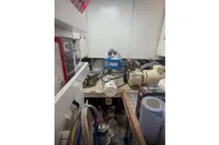 Engine room of a 2009 Pershing 72' yacht with various mechanical components.