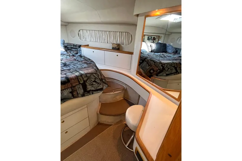  Yacht Photos Pics Luxurious 1997 Sea Ray 420 Aft Cabin interior with cozy bed and elegant furnishings.