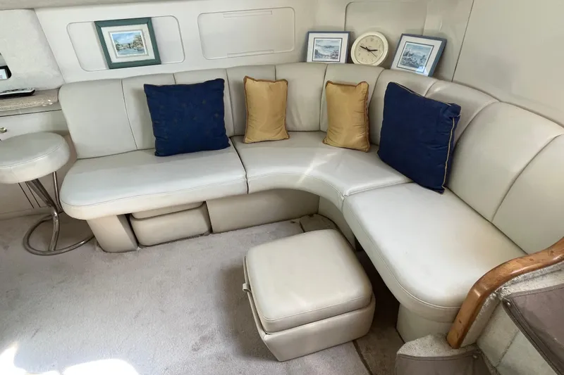  Yacht Photos Pics Luxurious 1997 Sea Ray 420 Aft Cabin interior with plush seating and decorative pillows.