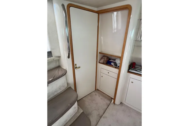  Yacht Photos Pics Interior of 1997 Sea Ray 420 Aft Cabin with stairs and storage cabinets.