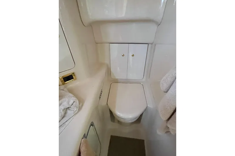  Yacht Photos Pics Bathroom interior of 1997 Sea Ray 420 Aft Cabin yacht, featuring compact design.