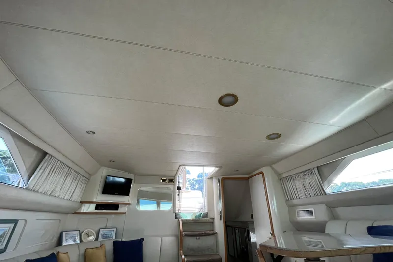  Yacht Photos Pics Interior of 1997 Sea Ray 420 Aft Cabin yacht, featuring cozy seating and modern amenities.