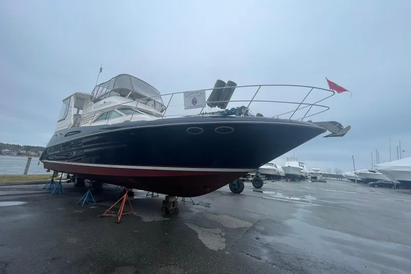  Yacht Photos Pics 1997 Sea Ray 420 Aft Cabin yacht on stands in a marina.