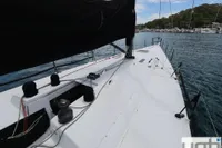Sailing yacht deck view, Custom Murray Burns Dovell 62, 1999, with black sail cover.