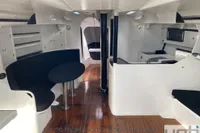 Interior of 1999 Custom Murray Burns Dovell 62 yacht with sleek design and wooden flooring.
