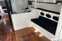 Interior of 1999 Custom Murray Burns Dovell 62 yacht with wooden flooring and seating area.
