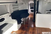 Interior of 1999 Custom Murray Burns Dovell 62 yacht with sleek design and wooden flooring.