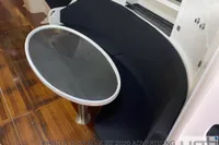 Cozy interior seating with oval table on 1999 Custom Murray Burns Dovell 62 yacht.