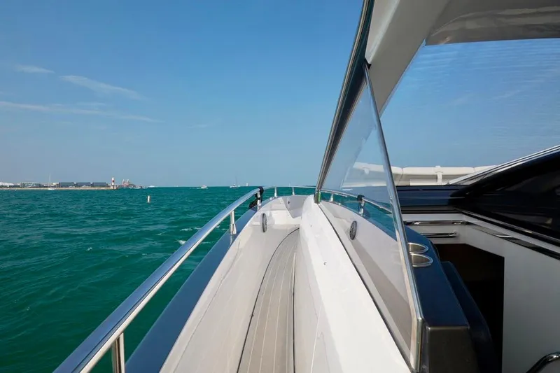  Yacht Photos Pics 2024 Azimut Verve 48 yacht cruising on open water, showcasing sleek design and luxury.