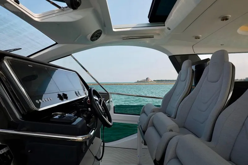 Yacht Photos Pics Interior view of 2024 Azimut Verve 48 yacht with modern helm and seating.