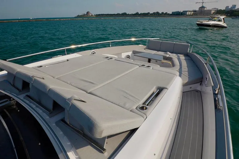  Yacht Photos Pics Luxurious 2024 Azimut Verve 48 yacht with spacious sunbathing deck on tranquil water.