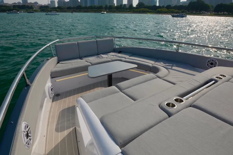  Yacht Photos Pics Luxurious 2024 Azimut Verve 48 yacht with spacious deck seating and scenic water view.