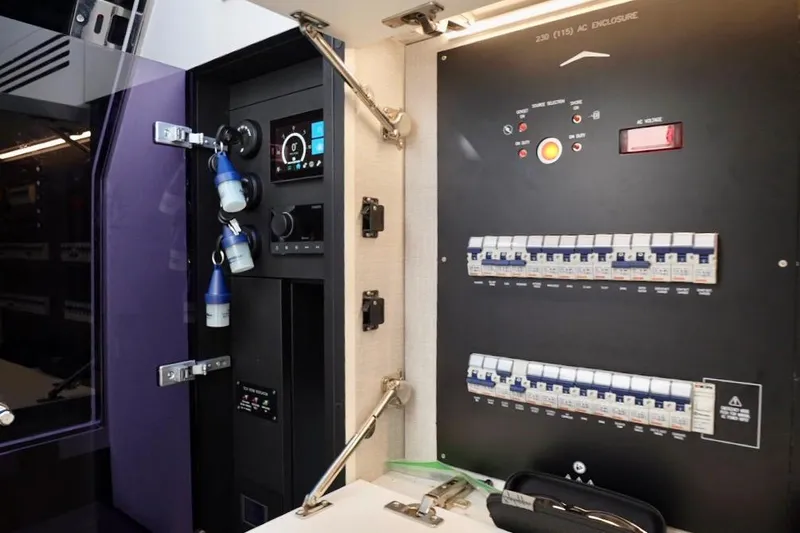  Yacht Photos Pics Electrical control panel inside 2024 Azimut Verve 48 yacht, featuring switches and gauges.